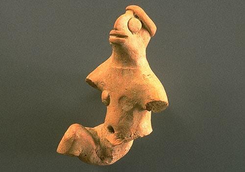 A few male figurines demonstrate unusual postures such as one with one leg extended forward and the other extended behind. Male figurines also sometimes wear a simple headband around the top of the head. Approximate dimensions (W x H x D): 4.3 x 7.2 x 3.2 cm.