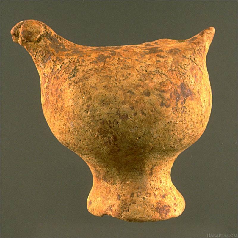 Among the most convincing cases for figurines as toys are the hollow bird figurines that have a hole either on the back near the tail or in front of the torso that allowed them to be used as whistles. Similar terracotta "bird whistles" are still found in South Asia. Approximate dimensions (W x H(L) x D): 3.8 x 5.5 x 5.3 cm. Photograph by Richard H. Meadow.