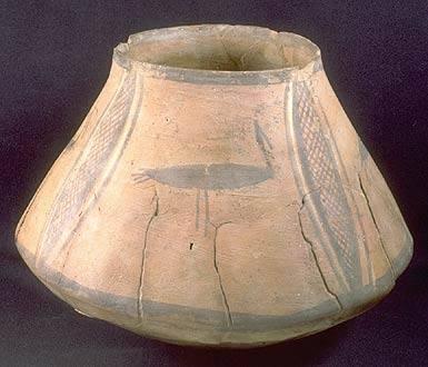 This Ravi Phase hand-built pot with polychrome design was found next to the one with intersecting circles (previous slide). The net and bird motifs are found at other sites to the northwest in Bannu district, but they do not continue n into the later Kot Diji and Harappa Phases.