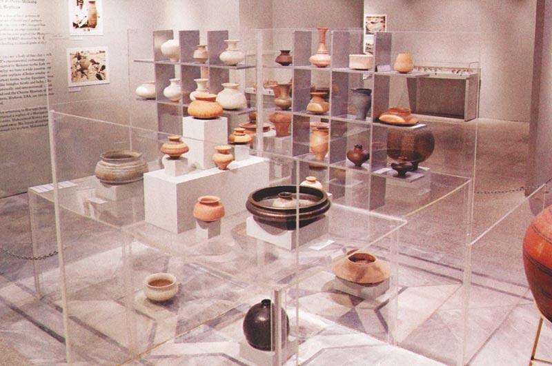 Pottery by Sherezade Alam displayed within acrylic swastika structure, Swastika Gallery