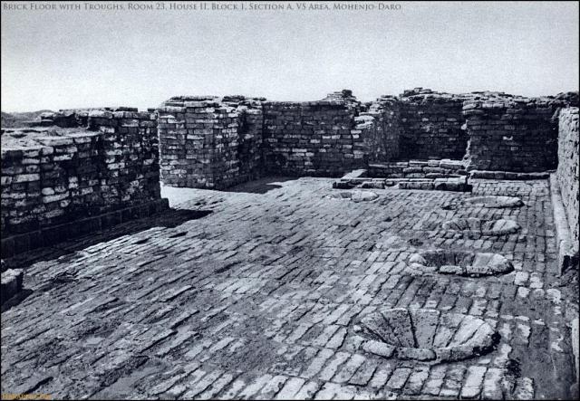 Room with brick floor and dyeing troughs.