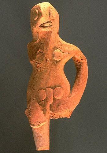 Other male figurines stand with their hands on their hips and their legs pressed together, a common posture for female figurines. Approximate dimensions (W x H x D): 4.0 x 9.7 x 2.8 cm.