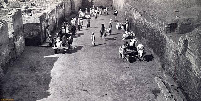 "That portion of First Street that runs alongside Blocks 3,5 and 6 has been excavated down to the foundation level of the Intermediate III occupation, at which level the width of the street varies from 32ft at the southern end to 30ft 3 ins at the north end of the section cleared... None the less, First Street was wide enough to take several of the vehicles of those days abreast. The scene in Plate XXIV, a, was arranged and photographed expressly to demonstrate this fact,"(MackKay, Mohenjo-daro,1938,I,p25)