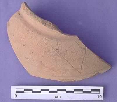 This sign was carved onto the pottery vessel after it was fired and may indicate the type of goods being stored in the vessel or the owner of the vessel itself. Another possible explanation is that this symbol represents a deity or spirit to which the contents of the vessel were sacrificed. This symbol becomes very common in the later Indus script.