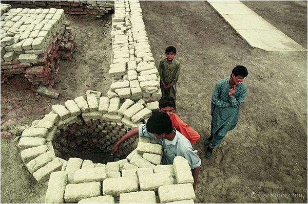  Although most wells were located inside private buildings, the city planners of Mohenjo Daro provided some public wells that could be accessed directly from the main street. This well and nearby walls have been covered with mud brick to protect them from salt crystallization