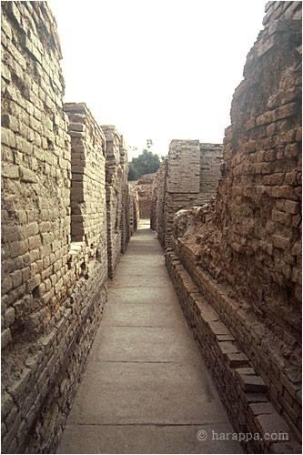  HR Area, Lane 2, looking east with Block 2 on the left (late 1920s). The streets and alleyways wind through the neighborhood and are usually oriented along a strict grid plan, one of the most remarkable features of this four and half thousand year old city.