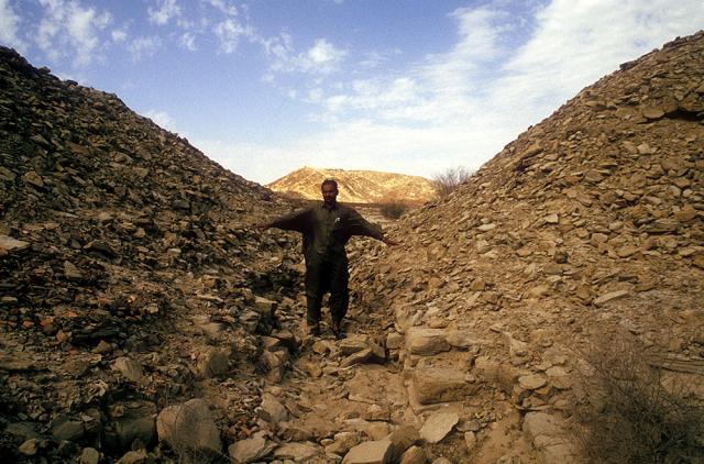 The mound-like structures on either side of the passage are up to 12 meters wide.