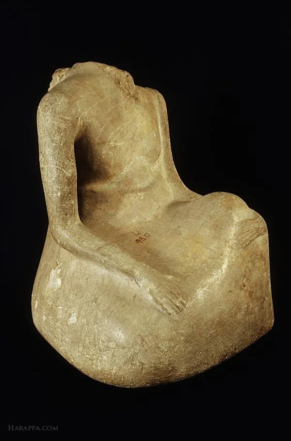 Seated male figure with head missing