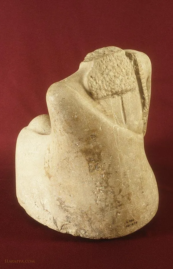 Seated male figure with head missing