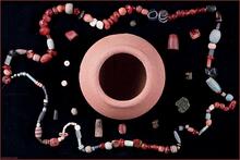 Faience beads of different shapes and colors were found in the bead pot. Some of these appear to be imitations of the natural stones; deep azure blue lapis lazuli, blue-green turquoise and banded to imitate banded agate.