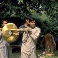Laboratory assistants Mohammad Naim, Shokat Ali, Said Ahmed, and Mukthar Massih carry the cleaned and conserved ringstone to the Harappa Museum for display.