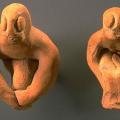 Most male figurines from Harappa sit with knees bent and arms at the sides of the legs or around the knees. Some of these figurines have facial features and even genitalia, and a few have stylized legs joined into a single projection.