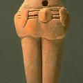 The multiple-strand belt on some of the female figurines is often accompanied by a plain short "skirt". The applied decorations on the belt may represent beads or other decorations. Approximate dimensions (W x H x D): 3.8 x 7.3 x 2.0 cm. (Photograph by Richard H. Meadow)