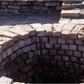 Wells were made with wedge shaped bricks to make a strong circular structure. Some bricks were made with special grooves to keep the ropes from sliding sideways when drawing water.