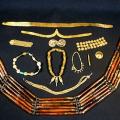 Indus jewelry made of gold, agate and carnelian. The gold filigrees at the top would have been worn around the head, at the bottom is a belt or necklace or carnelian.
