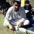 Mullah Ashur grinding beads